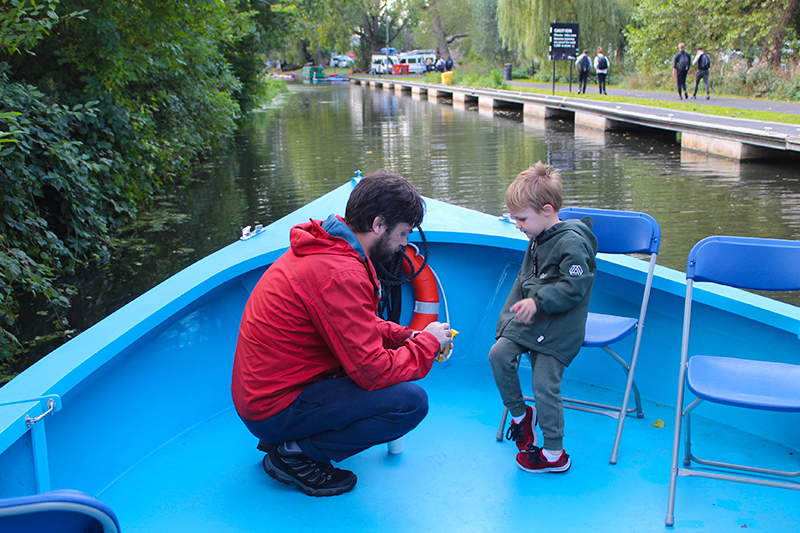 A child and parent on the All Aboard canal boat