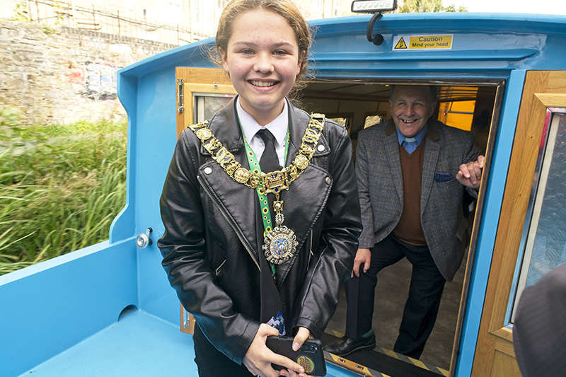 A young person wearing the Lord Provost's chain on the All Aboard canal boat