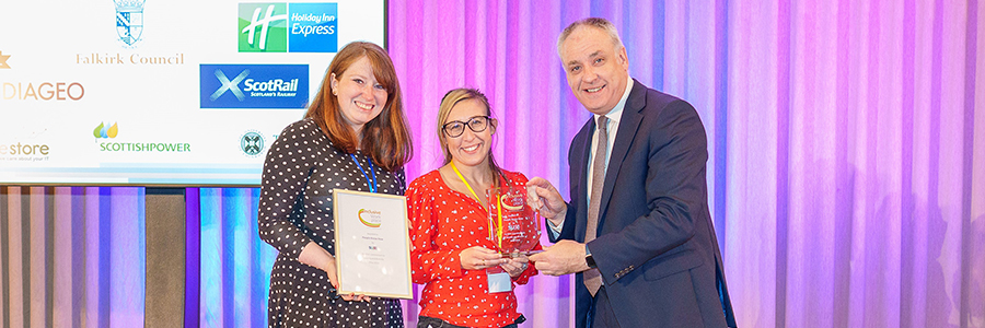 People Know How staff receiving the Inclusive Workspace Award