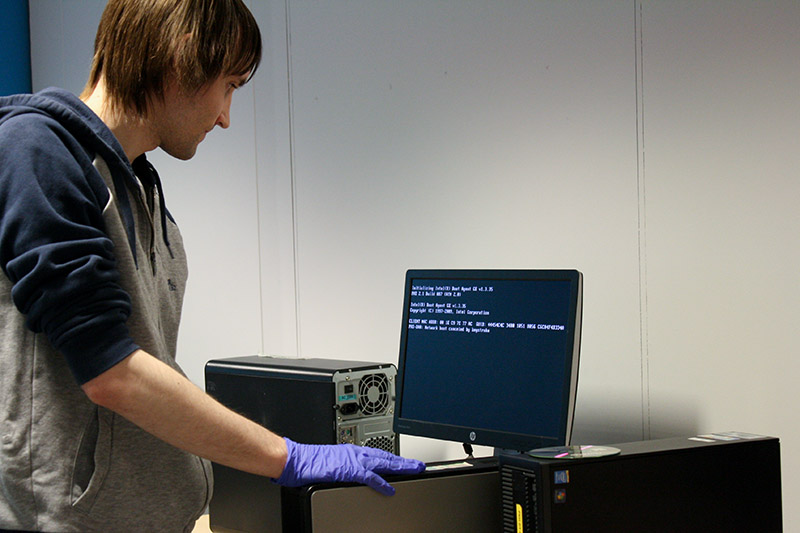 A person fixing a computer in Reconnect