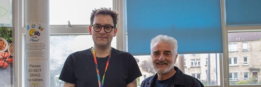 A Reconnect staff member and Tommy Sheppard MP smiling to camera