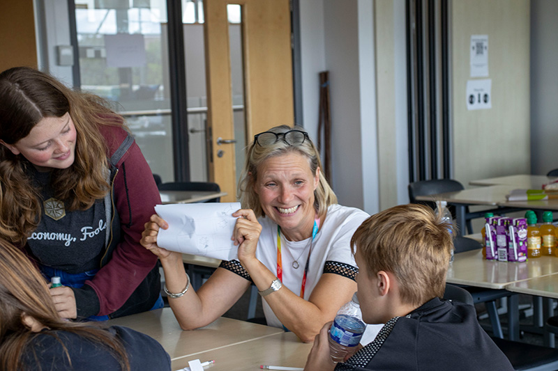 A coordinator and a young person at a table at a Positive Transitions session